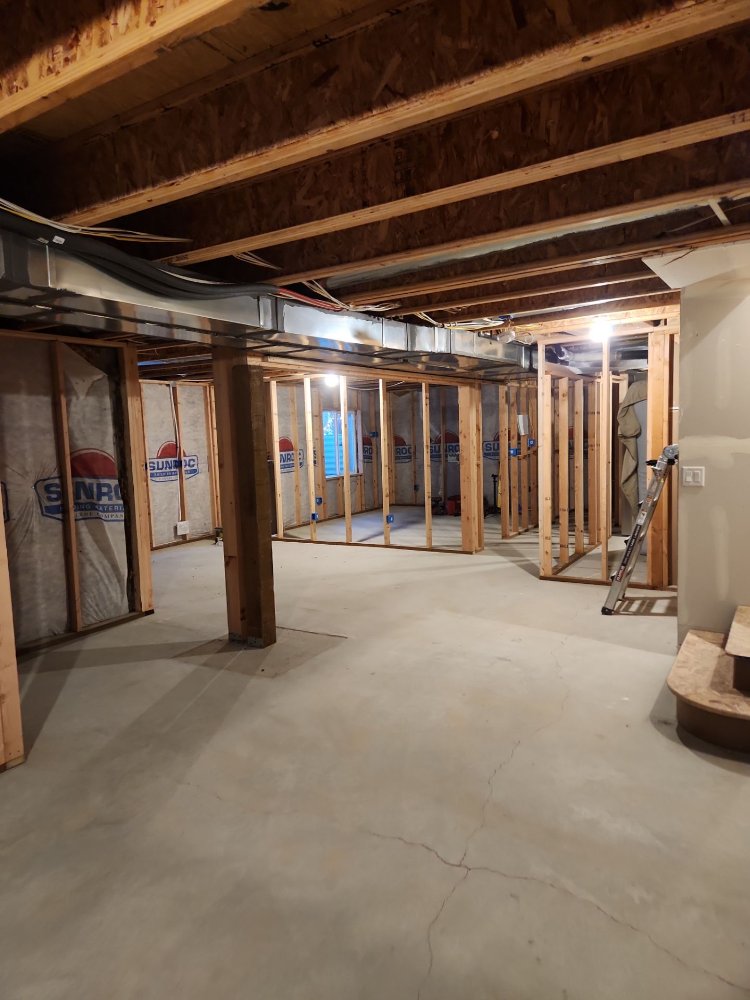 Basement remodeling project by RemodelCo in Daybreak, UT showing structural framing and layout preparation.-optimized