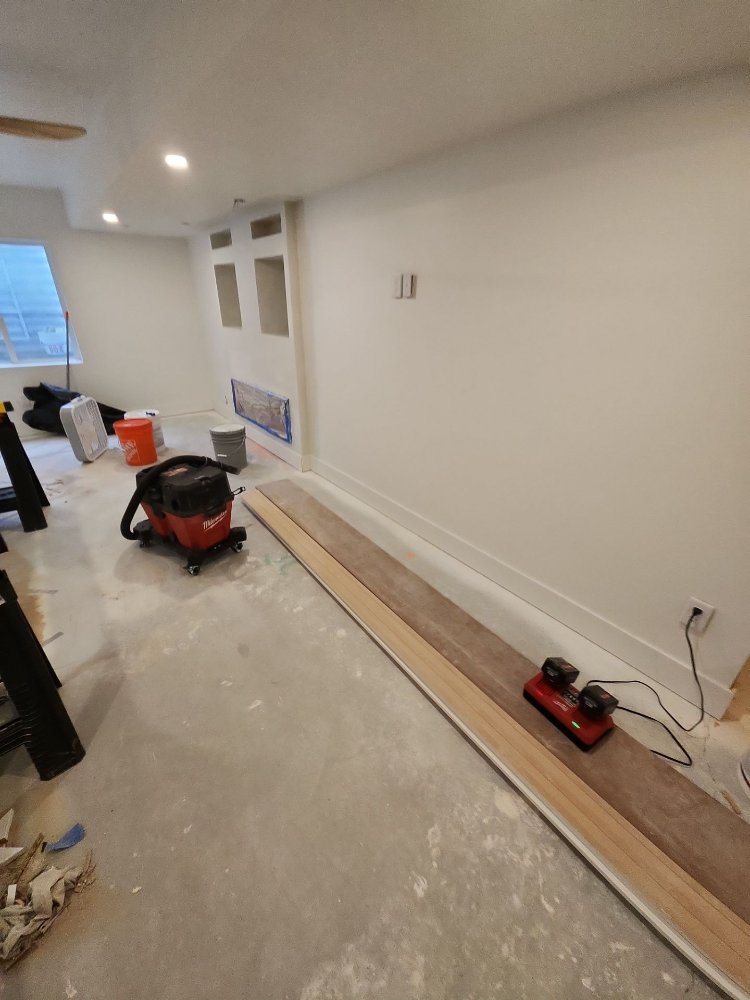 Basement remodeling project by RemodelCo in Daybreak, UT with preparation for built-in media features and finished walls.-optimized