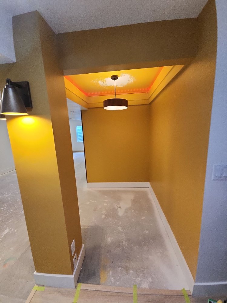 Custom architectural basement feature wall and illuminated niche from a RemodelCo basement remodel in Daybreak, UT.-optimized