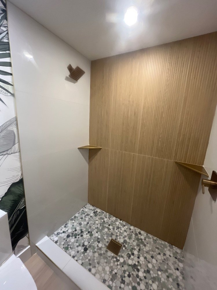 Custom tiled walk-in shower completed during a RemodelCo basement finishing project in Daybreak, UT.-optimized