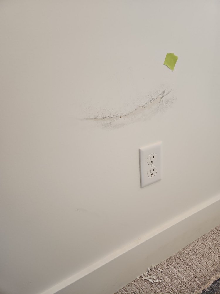 Drywall repair area marked for touch-up during a RemodelCo basement finish project in Daybreak, UT.-optimized
