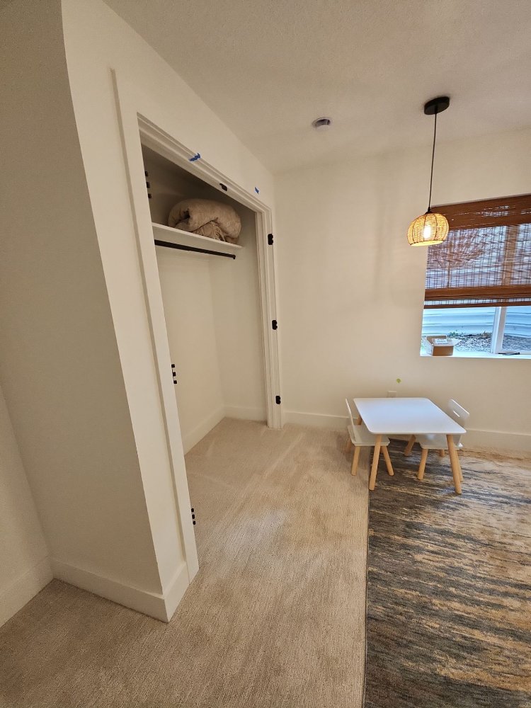 Finished basement passageway in Daybreak, UT remodeled by RemodelCo with clean lines and stylish interior details.-optimized