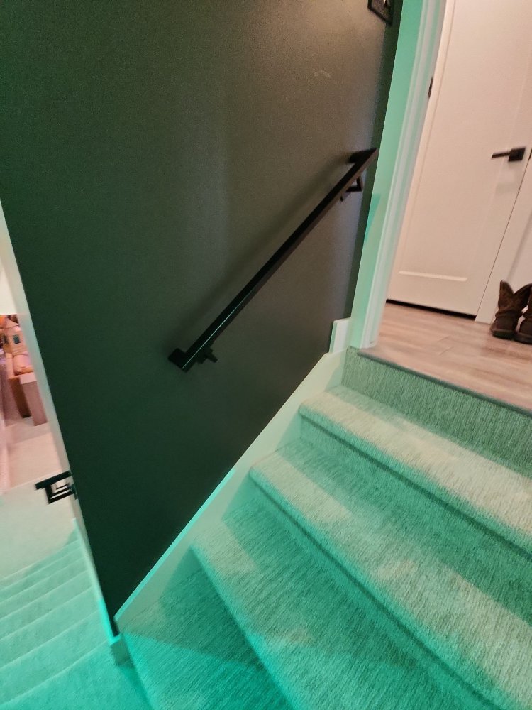 Modern staircase detail showcasing clean lines and updated finishes from a RemodelCo basement renovation in Daybreak, UT.-optimized