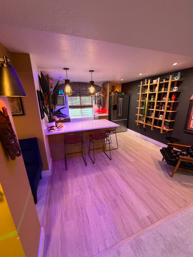 RemodelCo basement finish in Daybreak, UT featuring a custom entertainment kitchenette with quartz countertops, designer lightin-optimized