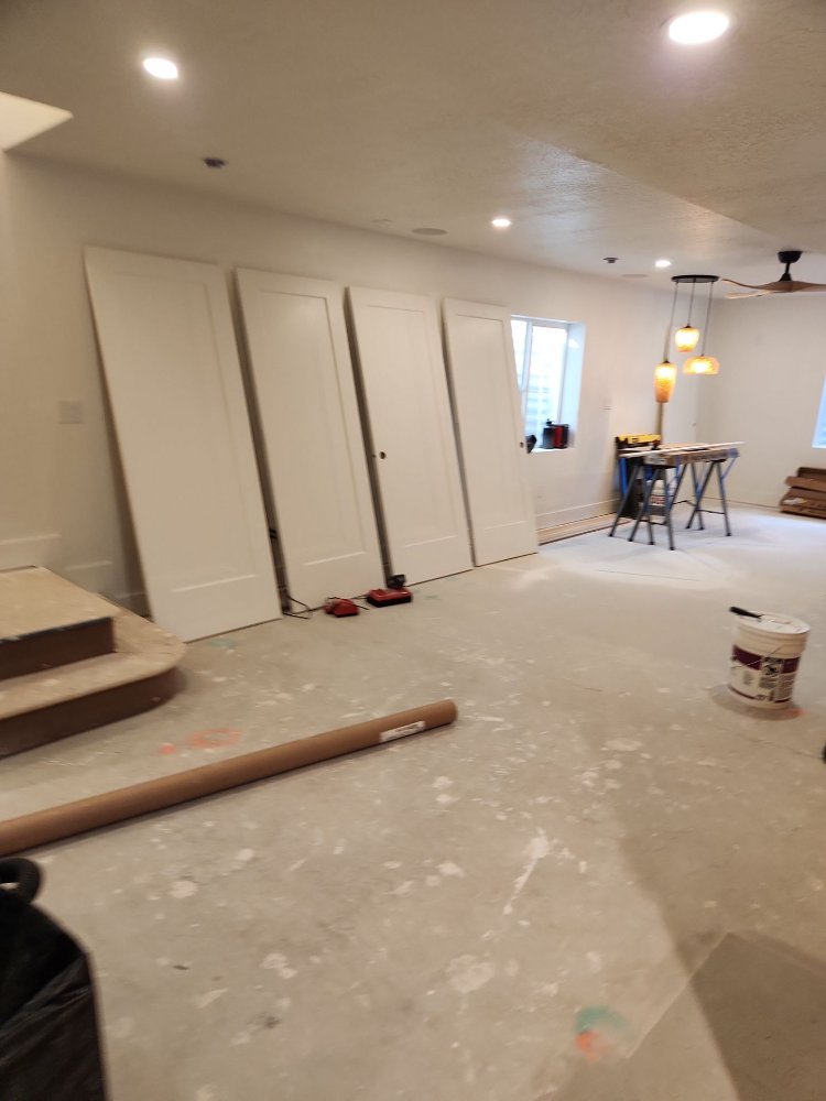 RemodelCo basement finish in Daybreak, UT showcasing custom sliding doors and an open-concept entertainment space under construc-optimized