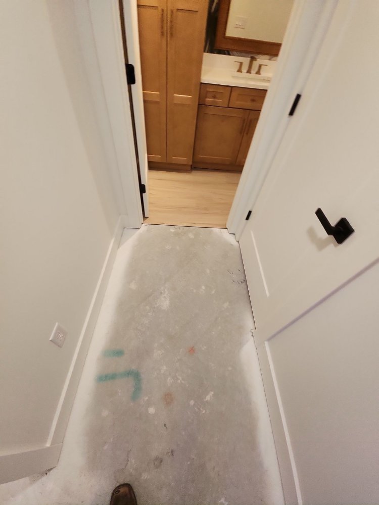 RemodelCo basement hallway remodel in Daybreak, UT connecting finished bedrooms and a custom bathroom suite.-optimized