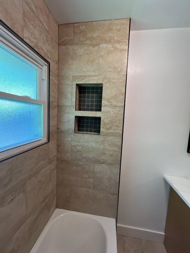 Bathroom renovation completed by RemodelCo in Salt Lake City, UT highlighting decorative shower niches and modern tile craftsman-optimized