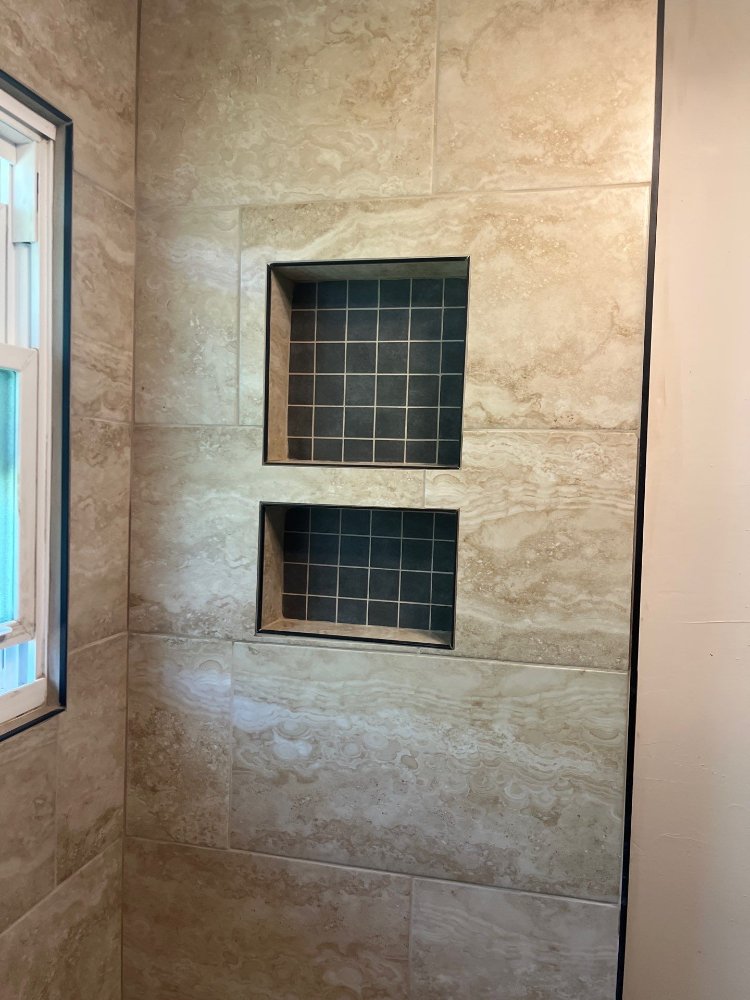 Bathroom renovation completed by RemodelCo in Salt Lake City, UT highlighting decorative shower niches and precision tile crafts-optimized