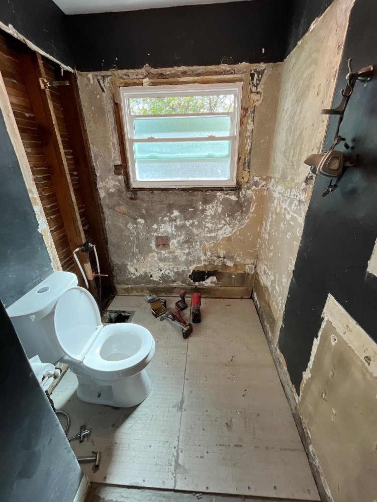 Bathroom renovation project by RemodelCo in Salt Lake City, UT with floor preparation completed before tile installation.-optimized