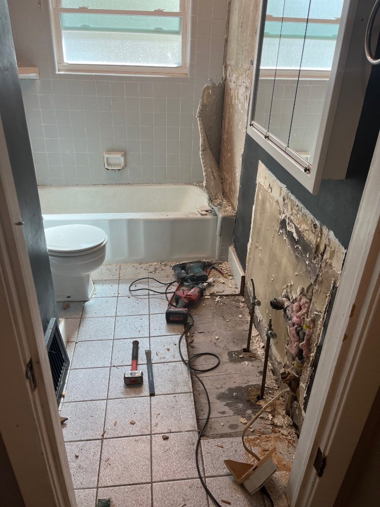 Existing bathroom walls removed to expose plumbing for RemodelCo bathroom renovation in Salt Lake City, UT.-optimized
