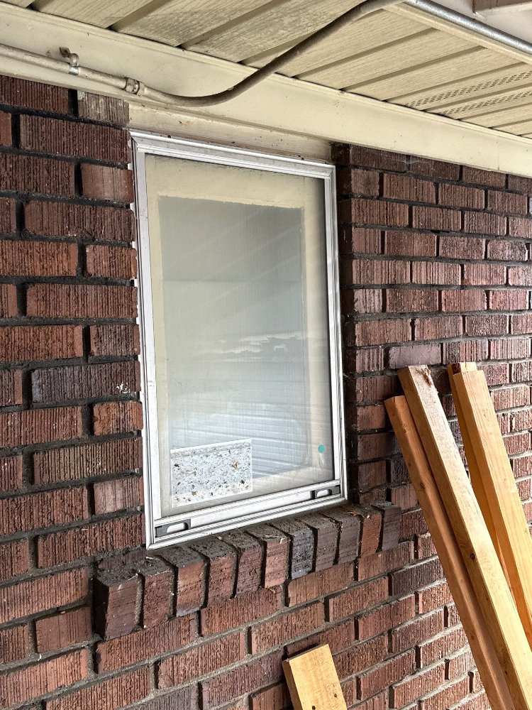 Existing exterior bathroom window in brick wall before RemodelCo bathroom remodel in Salt Lake City, UT.-optimized