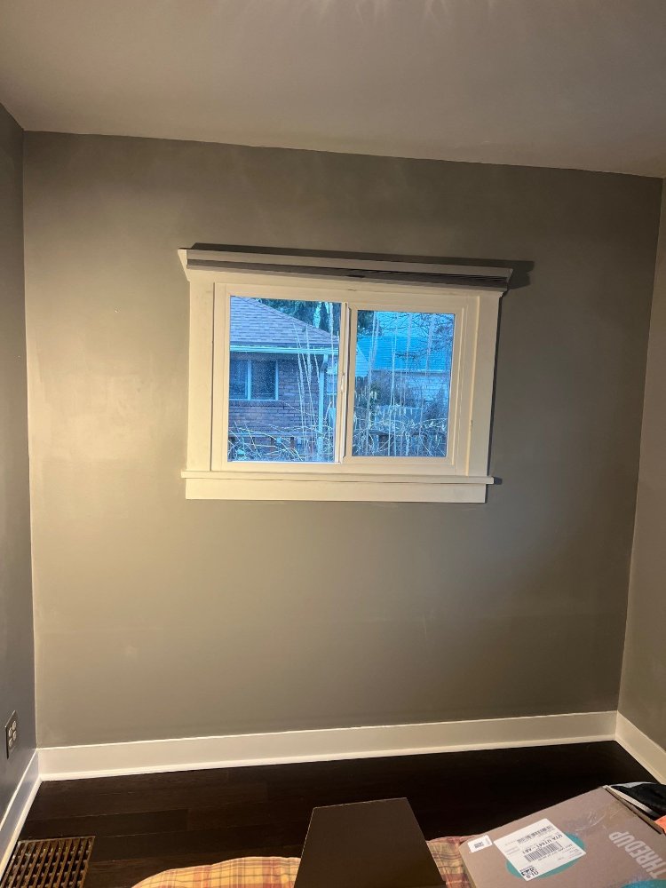 Fully restored bedroom wall and window area completed by RemodelCo in Salt Lake City, UT.-optimized