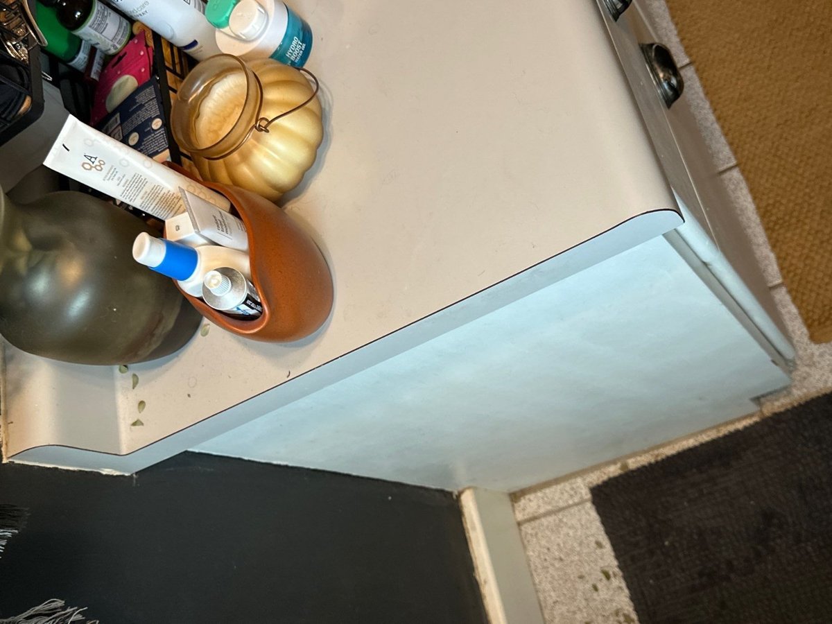 Original bathroom vanity surface and toiletries documented during RemodelCo bathroom renovation in Salt Lake City, UT.-optimized