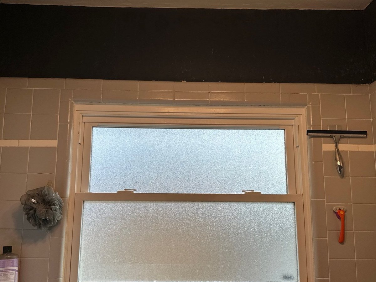 Original bathroom window and tile surround documented during RemodelCo bathroom remodeling project in Salt Lake City, UT.-optimized