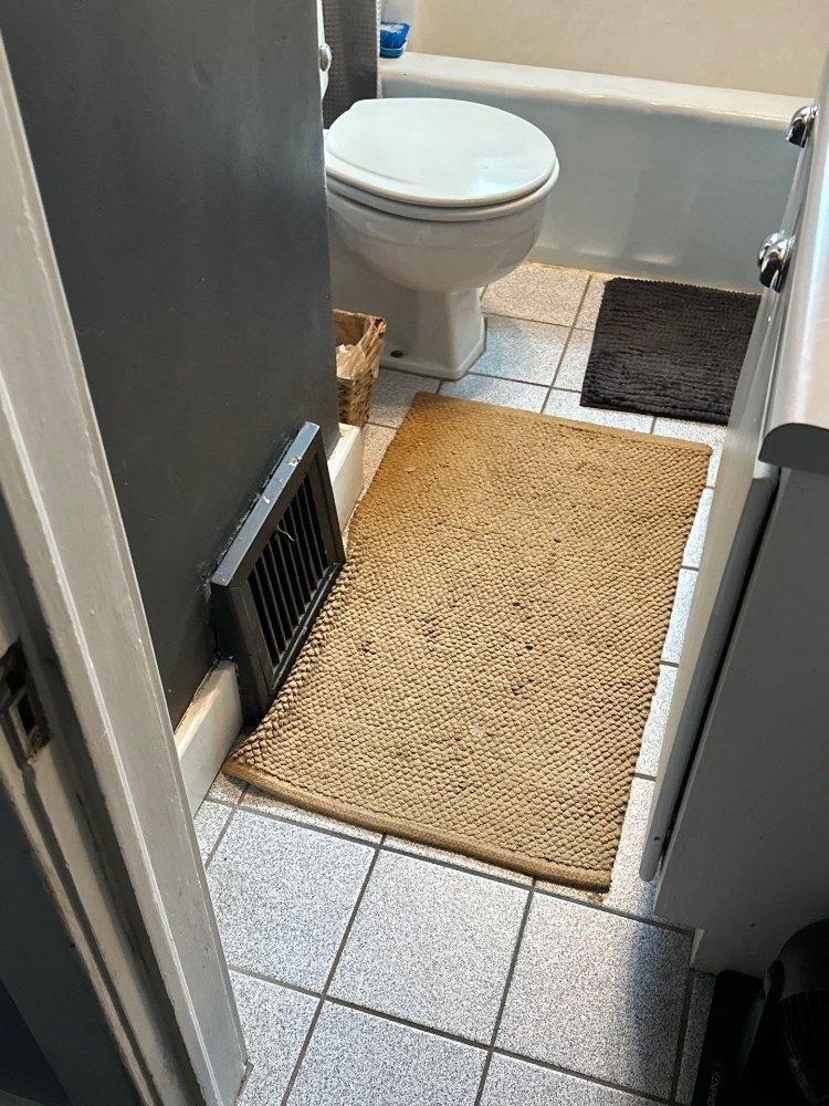 Pre-construction view of bathroom flooring and toilet placement for a RemodelCo bathroom remodel in Salt Lake City, UT.-optimized