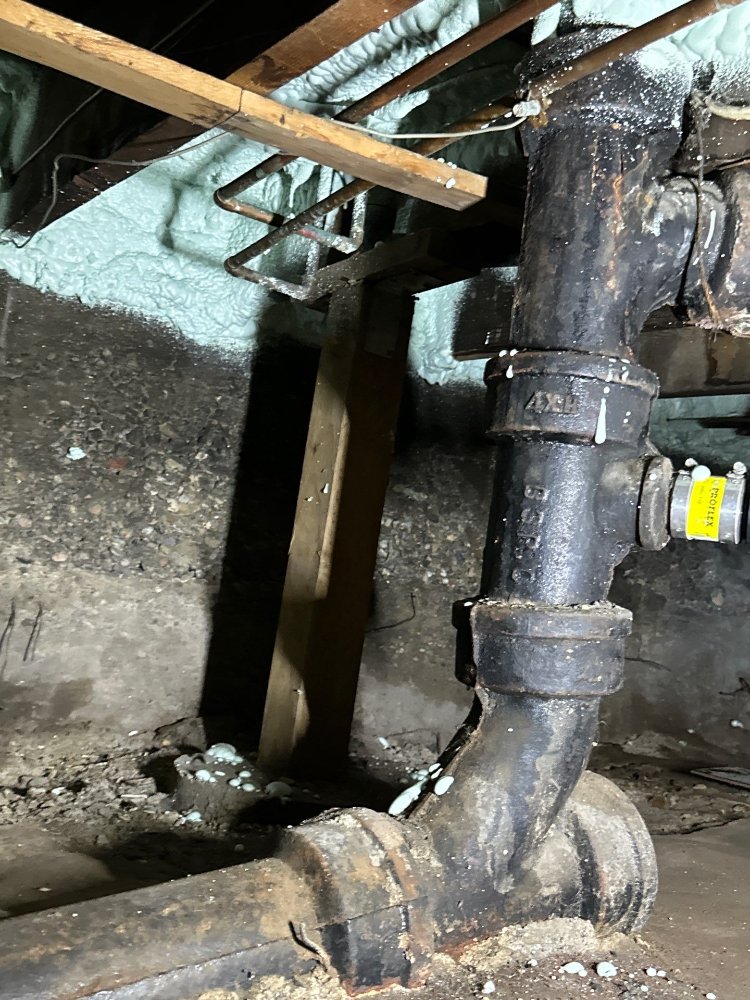 Pre-remodel crawl space inspection for a RemodelCo bathroom remodel in Salt Lake City, UT featuring exposed cast iron plumbing a-optimized