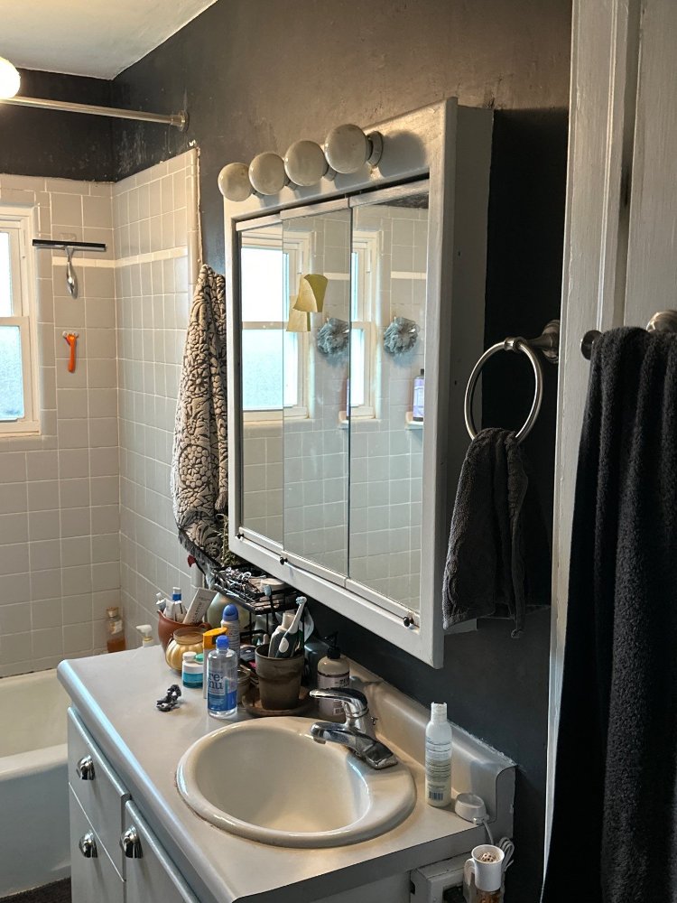Pre-renovation bathroom layout documented by RemodelCo in Salt Lake City, UT with original vanity and wall finishes.-optimized