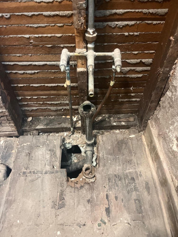 RemodelCo bathroom remodel in Salt Lake City, UT exposing existing plumbing and subfloor during demolition for a bathroom renova-optimized