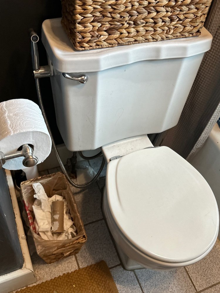 RemodelCo bathroom remodel project in Salt Lake City, UT showing the existing toilet and plumbing fixtures before renovation.-optimized