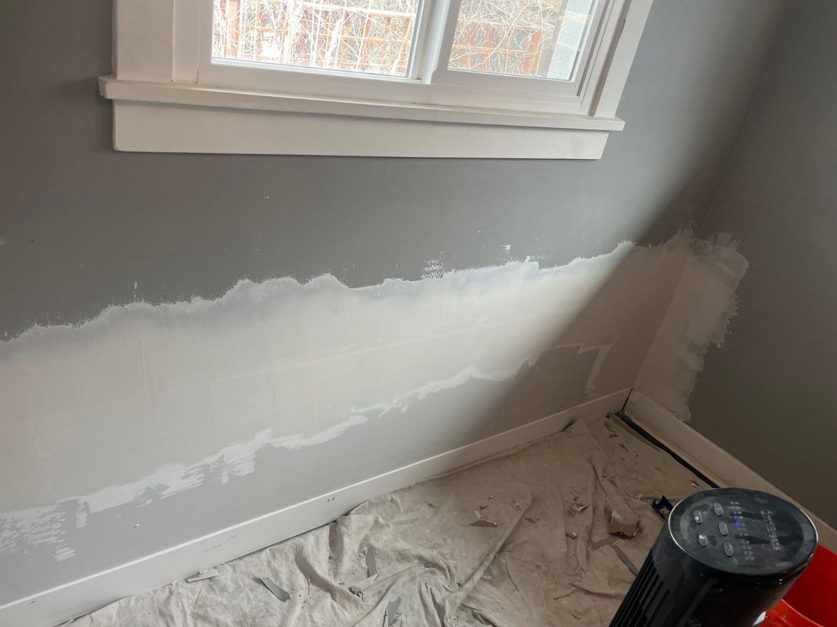 Repaired wall beneath window ready for paint during RemodelCo remodeling project in Salt Lake City, UT.-optimized