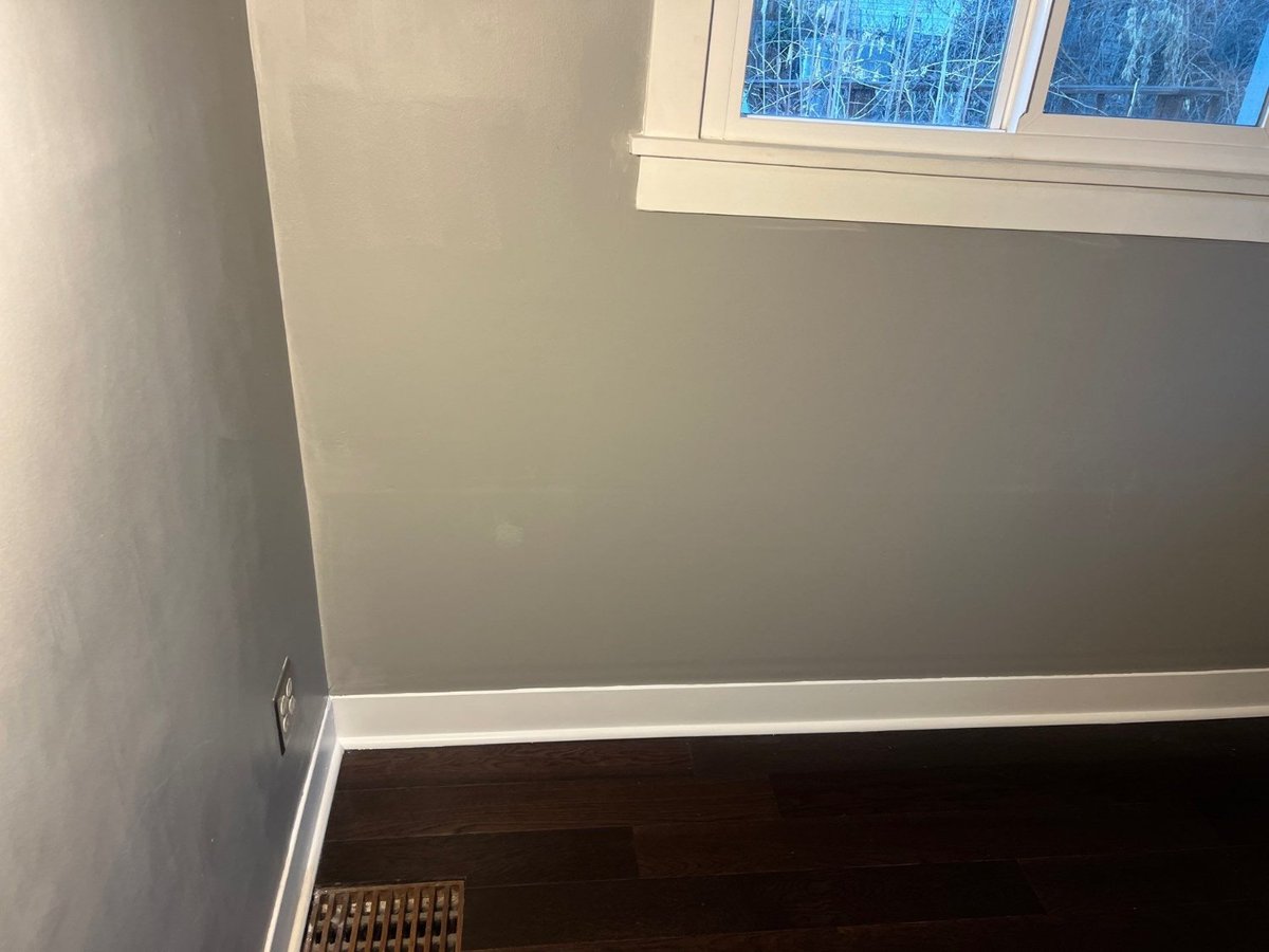 Restored bedroom wall with fresh paint after RemodelCo renovation in Salt Lake City, UT.-optimized