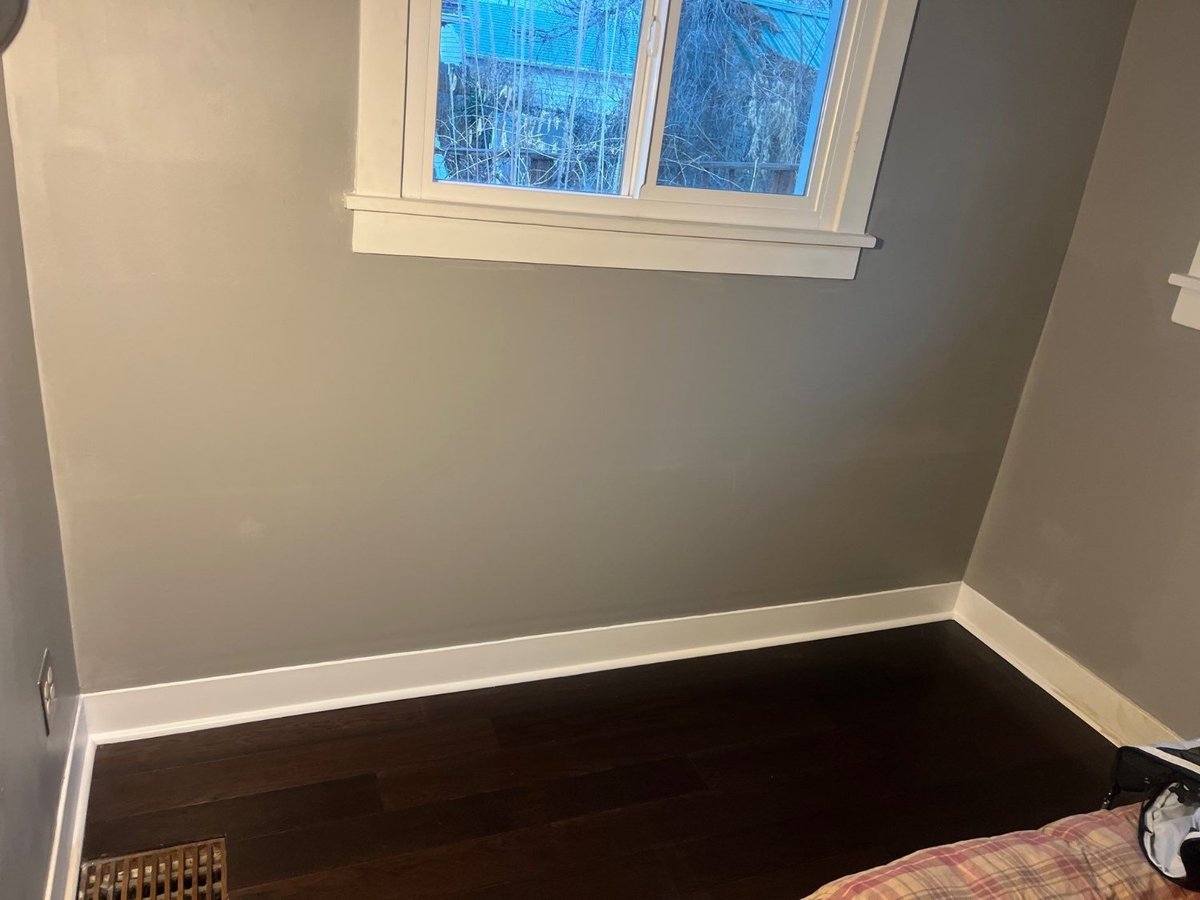 Restored wall beneath window showcasing finished remodel work by RemodelCo in Salt Lake City, UT.-optimized