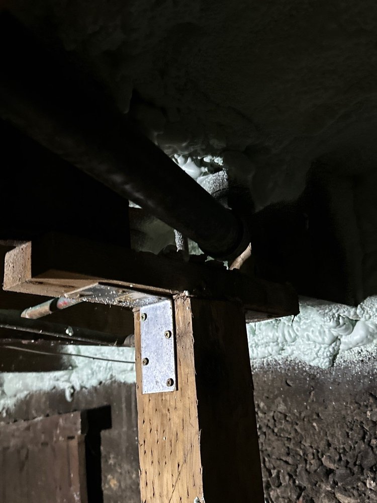 Underfloor framing and plumbing access area documented before a RemodelCo bathroom remodel in Salt Lake City, UT.-optimized