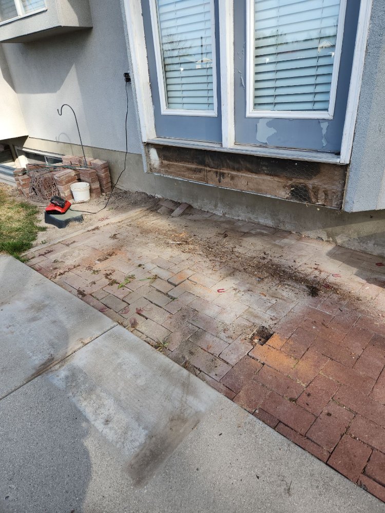 Deck demolition phase showing removed structure and exposed framing area by RemodelCo in Midvale, UT.-optimized