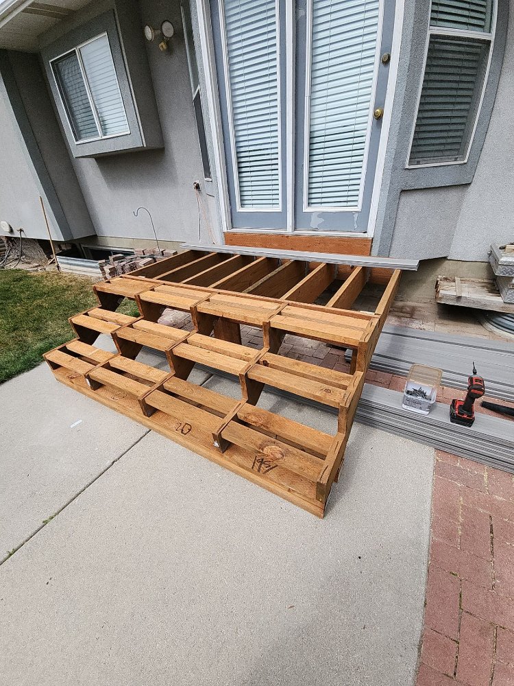 Deck rebuild project featuring completed framing before surface installation by RemodelCo in Midvale, UT.-optimized