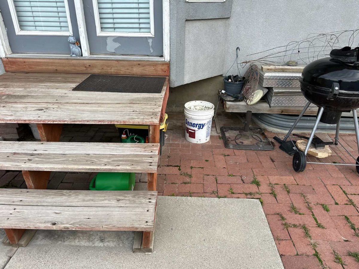Existing wood deck showing age and wear prior to remodeling by RemodelCo in Midvale, UT.-optimized