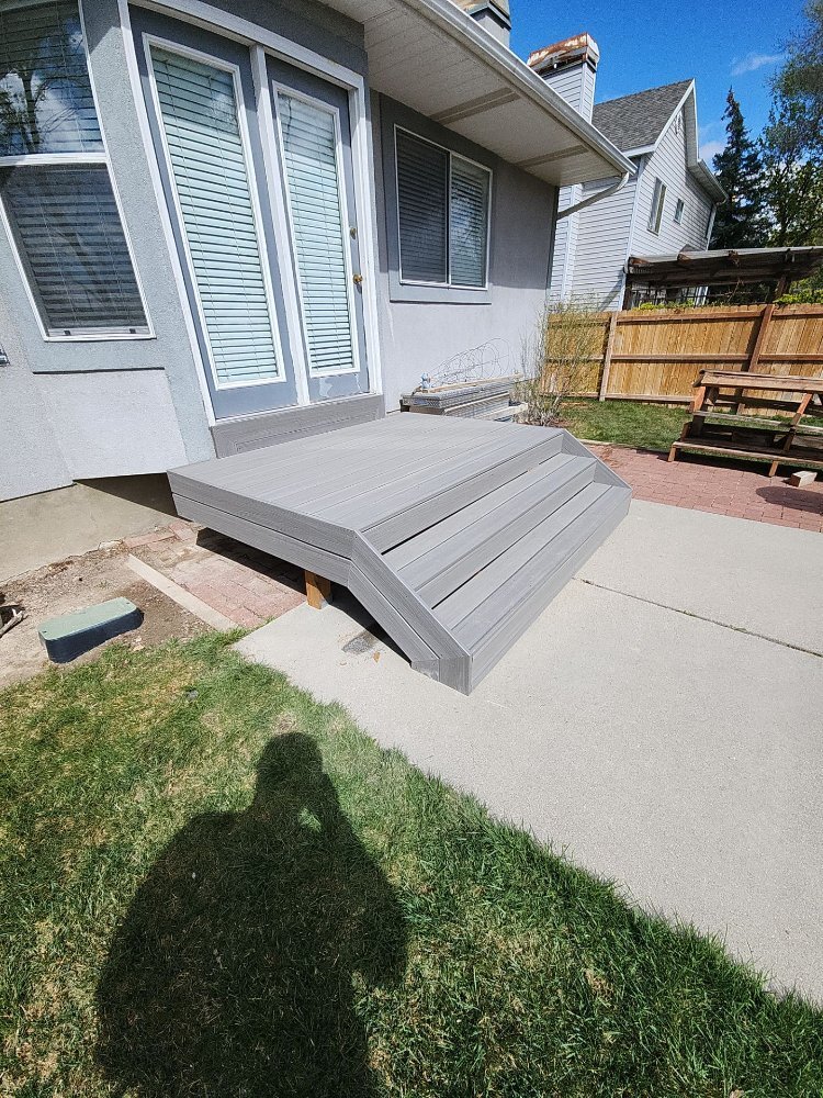 Finished gray composite deck installation enhancing outdoor living space in Midvale, UT by RemodelCo.-optimized