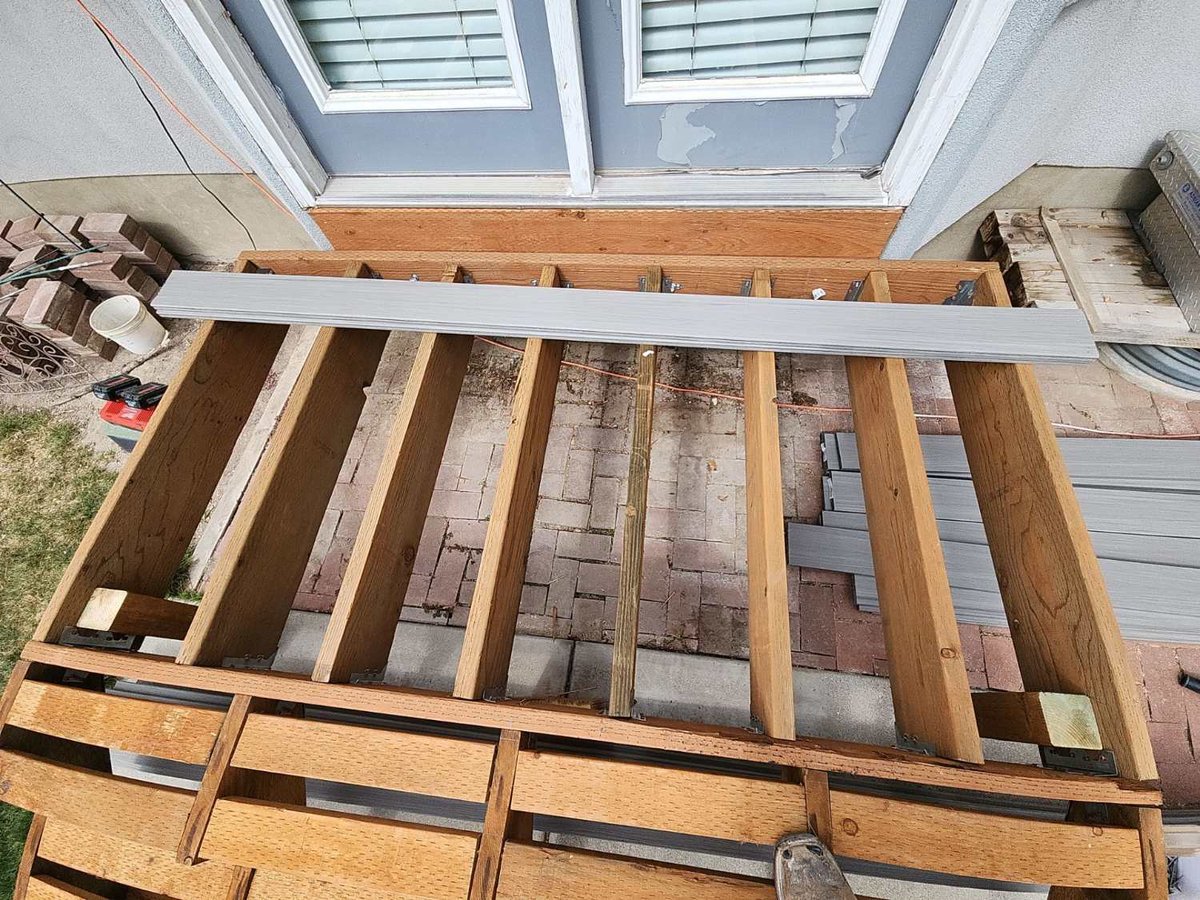 Overhead view of deck framing prepared for composite deck board installation by RemodelCo in Midvale, UT.-optimized