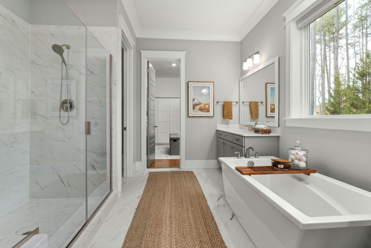 Luxury primary bathroom with marble tile shower, soaking tub, and custom vanity in a Sandy, UT bathroom remodel by RemodelCo sto-optimized