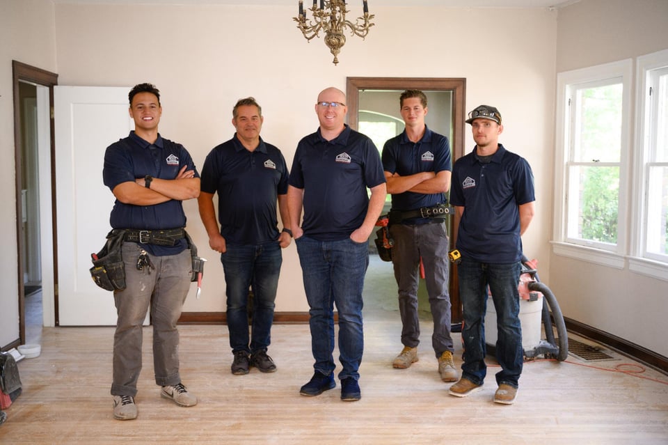 RemodelCo remodeling team standing together at a custom home renovation project in Sandy, UT.