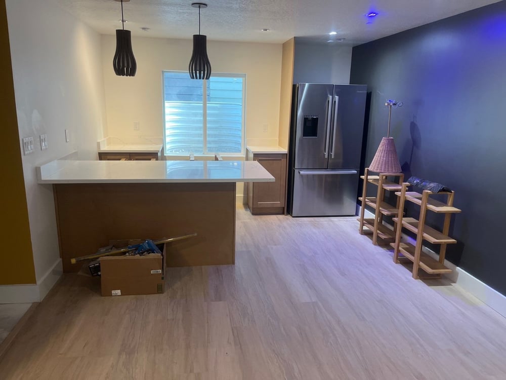 Contemporary basement bar remodel by RemodelCo in Daybreak, UT with sleek cabinetry, quartz surfaces, and luxury vinyl flooring.-optimized