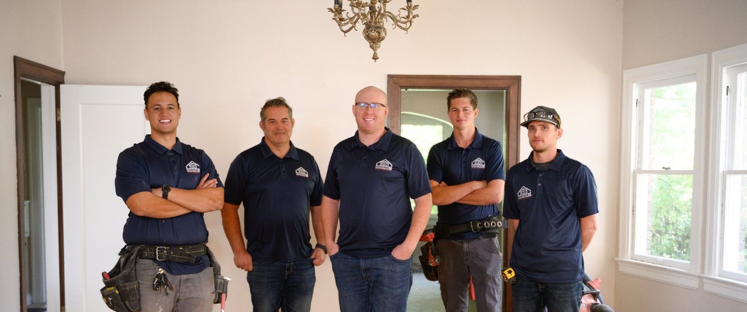 RemodelCo remodeling team standing together at a custom home renovation project in Sandy, UT