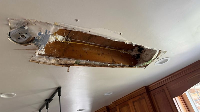 Image of damaged drywall on a kitchen ceiling