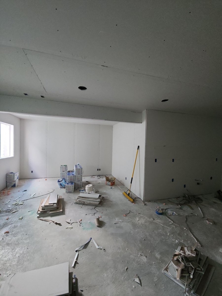 Drywall finishing underway in a basement bedroom during a Herriman, Utah basement remodel.