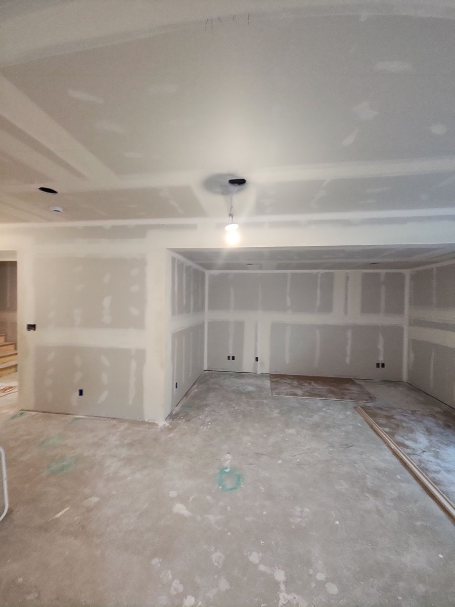 Drywall installation and finishing in an unfinished Herriman basement.