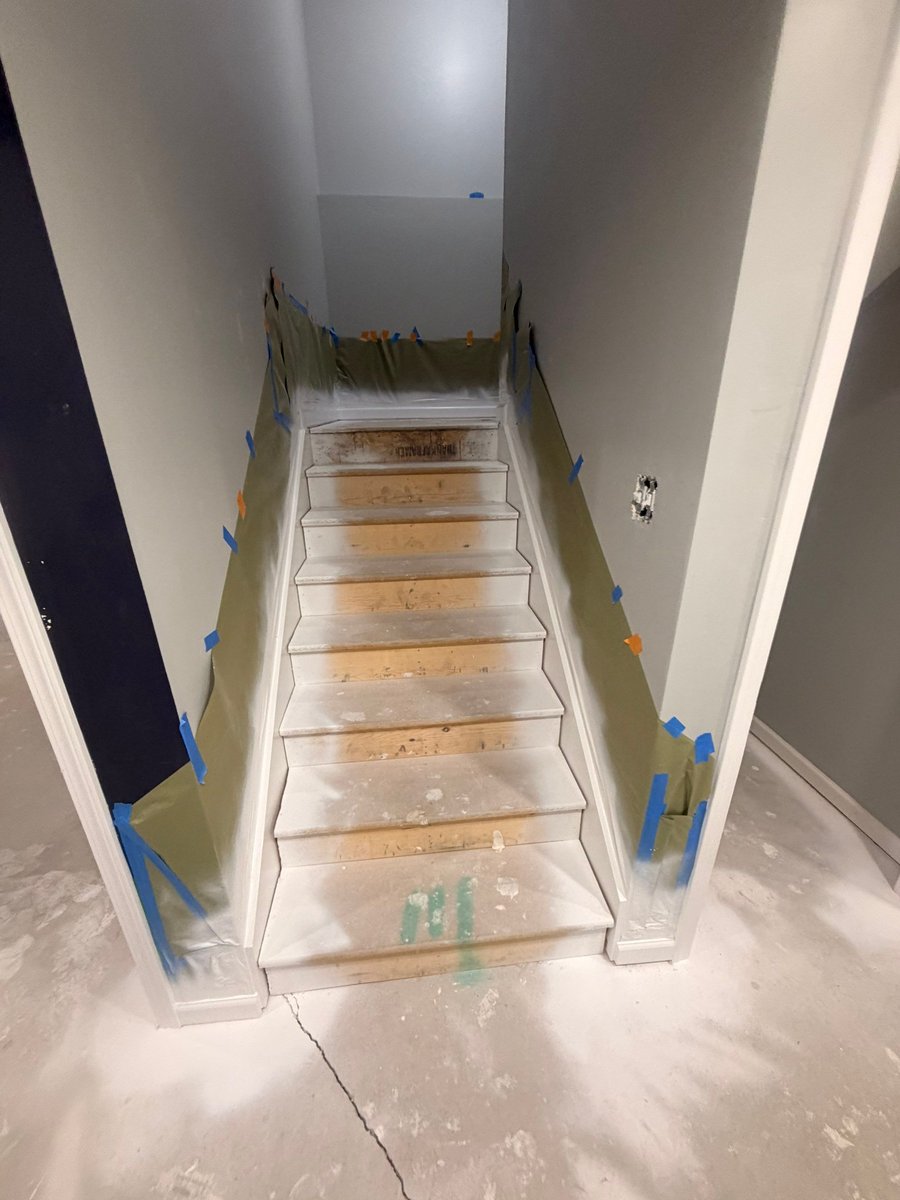 Basement stairs protected during painting and finishing work in Herriman.