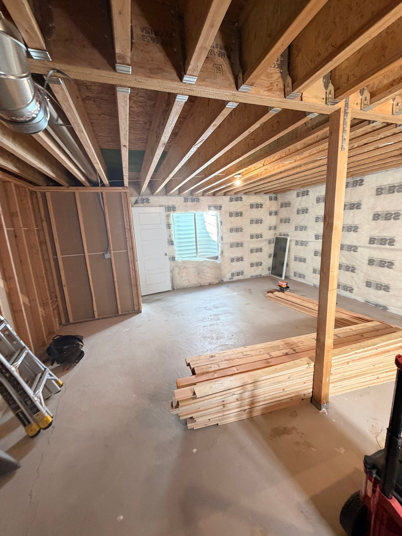 Basement framing and floor-plan layout during a RemodelCo basement finish in Herriman, Utah.