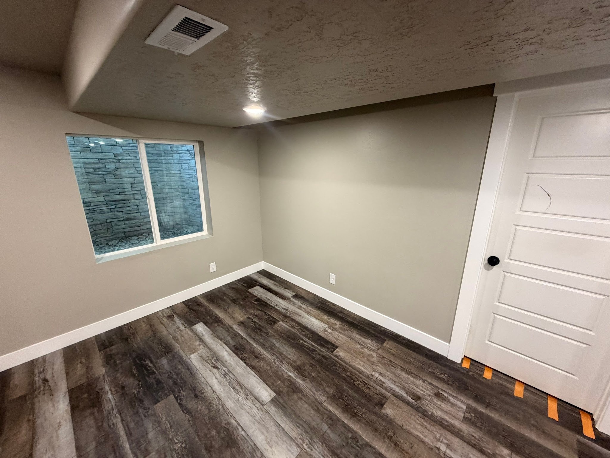 Finished basement bedroom or flex room by RemodelCo in Herriman, Utah.